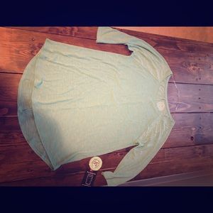 Three quarter length sleeve light weight shirt.